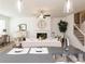 Open concept living area featuring a fireplace, a cozy seating area, and modern finishes throughout at 1567 Aiden Way # 34, Conyers, GA 30013
