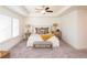 Bright and spacious main bedroom with ceiling fan, tray ceilings and large windows at 1567 Aiden Way # 34, Conyers, GA 30013