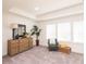 Relaxing main bedroom featuring tray ceiling, sitting area, and plush carpet for ultimate comfort at 1567 Aiden Way # 34, Conyers, GA 30013