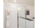 Close up of the shower with tiled walls and glass door in a modern bathroom at 1567 Aiden Way # 34, Conyers, GA 30013