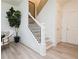 Bright staircase with white banister and black iron spindles, complemented by modern flooring and stylish decor at 1567 Aiden Way # 34, Conyers, GA 30013