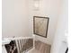 A view from the upper level of the staircase with the modern overhead light at 1567 Aiden Way # 34, Conyers, GA 30013