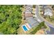 An aerial view shows a beautiful home with a pool and a spacious fenced backyard at 526 Lost Creek Dr, Woodstock, GA 30188