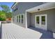 Showing the back of the house with access to the yard from the large deck at 526 Lost Creek Dr, Woodstock, GA 30188