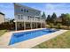 A sprawling backyard with large deck and in-ground pool and spa at 526 Lost Creek Dr, Woodstock, GA 30188