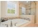 Luxurious bathroom featuring a jacuzzi tub and glass-enclosed shower at 526 Lost Creek Dr, Woodstock, GA 30188