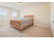 Bedroom with carpet, two windows, and wooden bed frame at 526 Lost Creek Dr, Woodstock, GA 30188