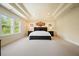 Bright bedroom features a tray ceiling, large windows with natural light, and modern furnishings at 526 Lost Creek Dr, Woodstock, GA 30188