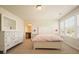 Bright bedroom with natural light, pink accents, and white furnishings at 526 Lost Creek Dr, Woodstock, GA 30188
