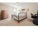 Bedroom with neutral carpet, wooden bed frame, and matching dresser at 526 Lost Creek Dr, Woodstock, GA 30188