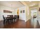 Elegant dining room with a dark wood table, chandelier, and wainscoting at 526 Lost Creek Dr, Woodstock, GA 30188