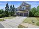 Charming two-story home with stone and siding, and a manicured front lawn at 526 Lost Creek Dr, Woodstock, GA 30188