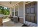 Inviting front porch with seating, perfect for enjoying a morning coffee or an evening sunset at 526 Lost Creek Dr, Woodstock, GA 30188