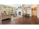 Comfortable living room with fireplace, hardwood floors, and large windows providing natural light at 526 Lost Creek Dr, Woodstock, GA 30188