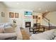 Living room boasts a fireplace, TV, hardwood flooring, and a staircase to the next level at 526 Lost Creek Dr, Woodstock, GA 30188