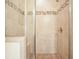 The elegant shower features beautiful tile work with a decorative mosaic border and glass door at 526 Lost Creek Dr, Woodstock, GA 30188