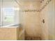 Modern shower with glass door, mosaic tile accent, and built-in seat at 526 Lost Creek Dr, Woodstock, GA 30188