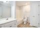 Bathroom featuring a vanity, toilet, and shower/bath, all with modern fixtures at 560 Austin Dr, Mcdonough, GA 30252
