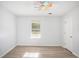 A bright bedroom with light gray walls and a ceiling fan, providing a clean and airy space at 560 Austin Dr, Mcdonough, GA 30252