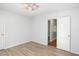 Bright bedroom featuring a ceiling fan, light gray walls, and wood flooring at 560 Austin Dr, Mcdonough, GA 30252