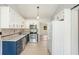 Updated kitchen with stainless steel appliances, granite countertops, and white cabinets at 560 Austin Dr, Mcdonough, GA 30252