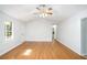Bright living room with hardwood floors and large windows at 560 Austin Dr, Mcdonough, GA 30252