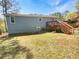 A backyard showcasing a wooden deck with stairs, complementing the home's exterior at 5790 Ivywood Dr, Lithonia, GA 30038