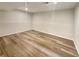 Spacious basement with wood-look flooring, ready for customization and additional living space at 5790 Ivywood Dr, Lithonia, GA 30038
