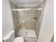 Modern bathroom features a tiled shower with a glass door and updated fixtures for comfort at 5790 Ivywood Dr, Lithonia, GA 30038