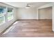 The living room features wood-look flooring and bright natural light from the white-trimmed windows at 5790 Ivywood Dr, Lithonia, GA 30038