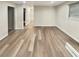 Versatile living space featuring wood-look flooring and neutral walls, perfect for various uses at 5790 Ivywood Dr, Lithonia, GA 30038