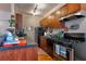 Well-equipped kitchen features black countertops, gas range, and ample storage at 741 Frederica Ne St # 8, Atlanta, GA 30306