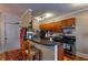 Functional kitchen with breakfast bar, wood cabinets, and modern appliances at 741 Frederica Ne St # 8, Atlanta, GA 30306