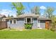 Charming backyard featuring a well-maintained lawn and a cozy cottage-style home exterior at 873 United Se Ave, Atlanta, GA 30312