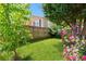 Spacious backyard with a privacy fence, mature trees, and blooming flowers creating a peaceful outdoor oasis at 873 United Se Ave, Atlanta, GA 30312