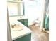 Bathroom features double sinks, mint green cabinets, and a shower, providing ample space at 873 United Se Ave, Atlanta, GA 30312