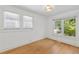 Bedroom featuring hardwood floors and sun-filled windows at 873 United Se Ave, Atlanta, GA 30312