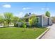 Attractive home with a covered porch, green lawn, mature trees, and a driveway, presenting a desirable exterior at 873 United Se Ave, Atlanta, GA 30312