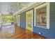 Eye-catching front porch featuring a painted beadboard ceiling, three ceiling fans, and glossy wood flooring at 873 United Se Ave, Atlanta, GA 30312