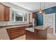 Well-lit kitchen with granite counters, kitchen island, and stainless steel appliances at 873 United Se Ave, Atlanta, GA 30312