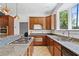 Updated kitchen featuring stainless appliances, granite counters, and ample cabinet space at 873 United Se Ave, Atlanta, GA 30312
