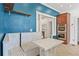 Eat-in kitchen features built-in booth seating, open shelving, and stainless steel appliances at 873 United Se Ave, Atlanta, GA 30312