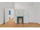 Well-lit living room with hardwood floors and a decorative fireplace at 873 United Se Ave, Atlanta, GA 30312