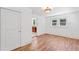 Hardwood floors and bright white walls make this living room with an open doorway feel welcoming at 873 United Se Ave, Atlanta, GA 30312