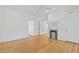 Spacious living room with hardwood floors, a fireplace, and open doorways at 873 United Se Ave, Atlanta, GA 30312