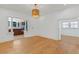 Bright living room boasts gleaming hardwood floors, decorative lighting, and an open floor plan at 873 United Se Ave, Atlanta, GA 30312