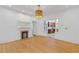 Open-concept living room with hardwood floors and a glimpse into the kitchen at 873 United Se Ave, Atlanta, GA 30312