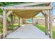 Covered outdoor patio with a pergola featuring beach mural and decorative string lights at 873 United Se Ave, Atlanta, GA 30312
