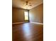 Spacious bedroom featuring laminate flooring, neutral walls, and a ceiling fan with integrated lighting at 225 Austin Oaks Se Dr, Ellenwood, GA 30294