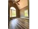 Bedroom featuring vaulted ceiling, two windows offering ample natural light, and wood laminate flooring at 225 Austin Oaks Se Dr, Ellenwood, GA 30294